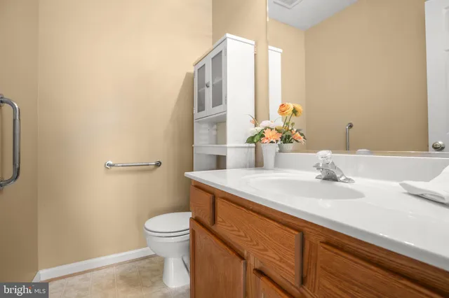 a kitchen with a stove a refrigerator a sink dishwasher with a dining table and chairs