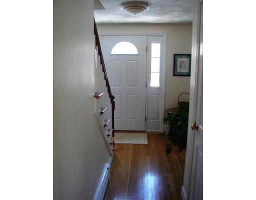 10 Scott Road Harvard, MA 01451 - Photo 3 of 13 a view of a hallway with wooden floor and stairs