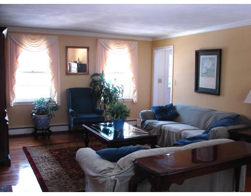 10 Scott Road Harvard, MA 01451 - Photo 4 of 13 a living room with furniture potted plant and a window