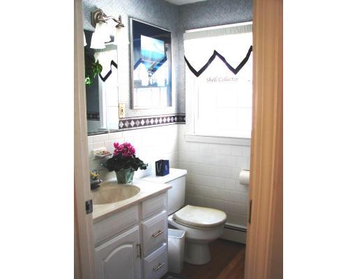 10 Scott Road Harvard, MA 01451 - Photo 10 of 13 a bathroom with a toilet sink and mirror