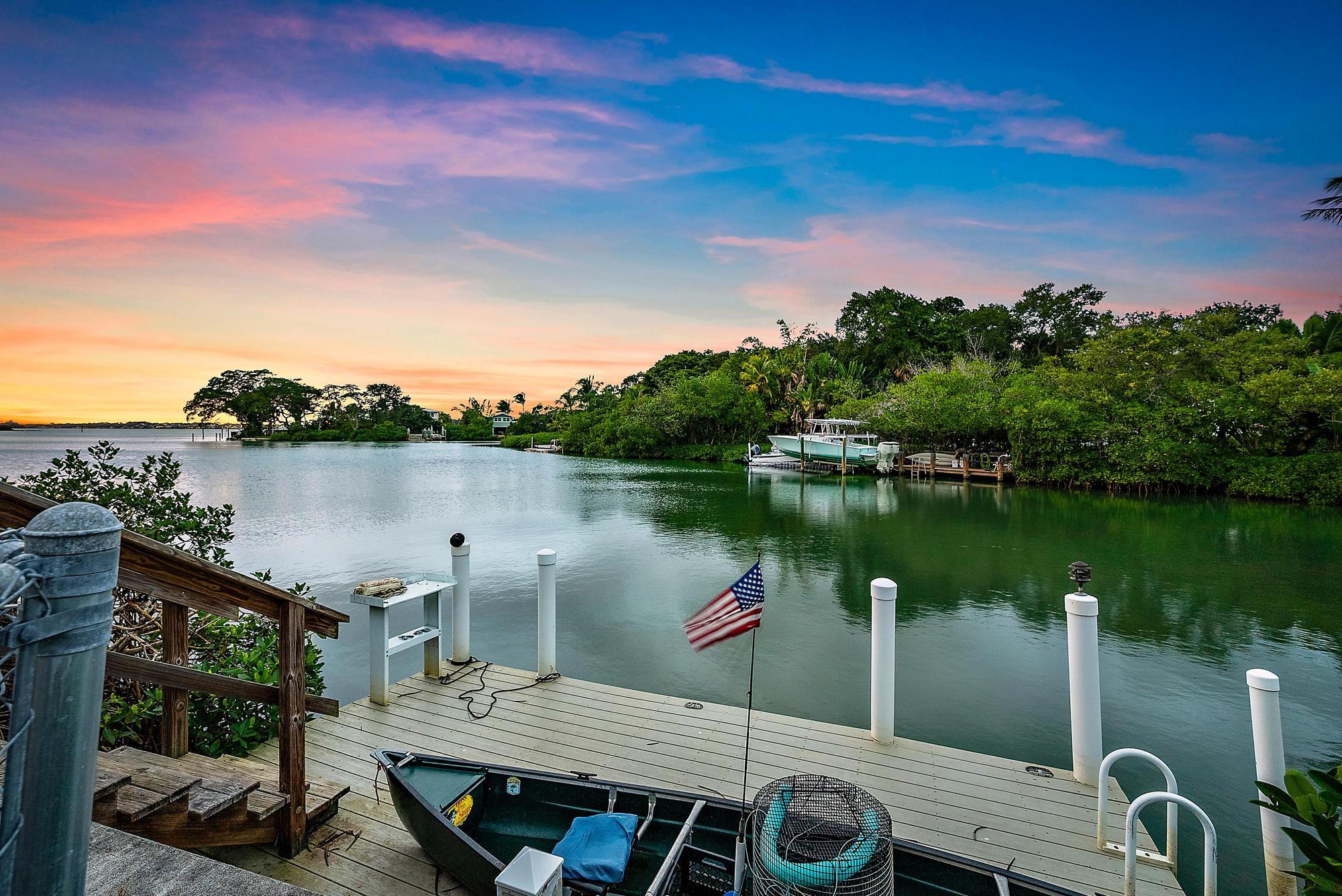 1310 Peninsular Road Jupiter, FL 33469 - Photo 16 of 17 a view of a lake with couches chairs