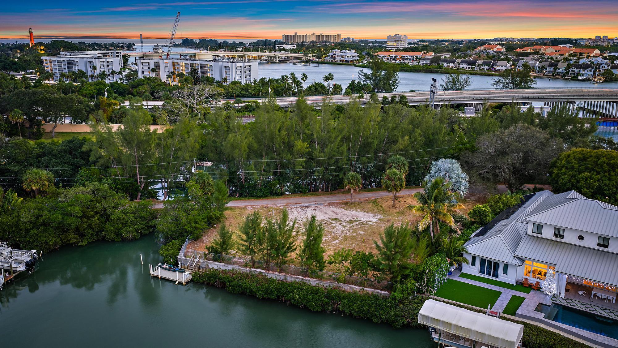 1310 Peninsular Road Jupiter, FL 33469 - Photo 3 of 17 an aerial view of residential house with outdoor space and lake view