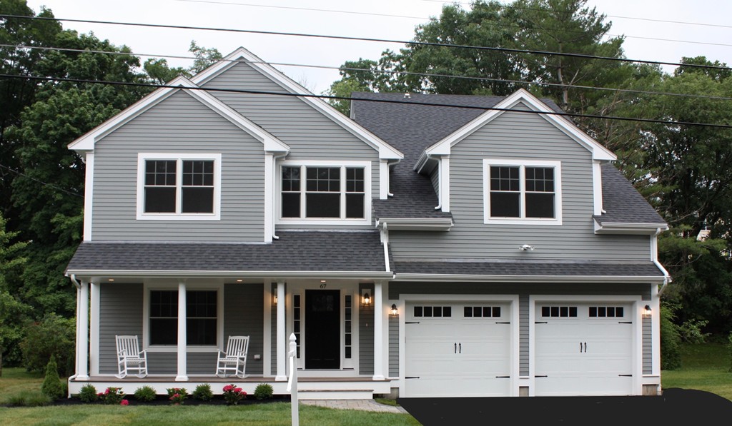 67 Evelyn Road Needham, MA 02494 - Photo 1 of 13 a front view of a house with a yard