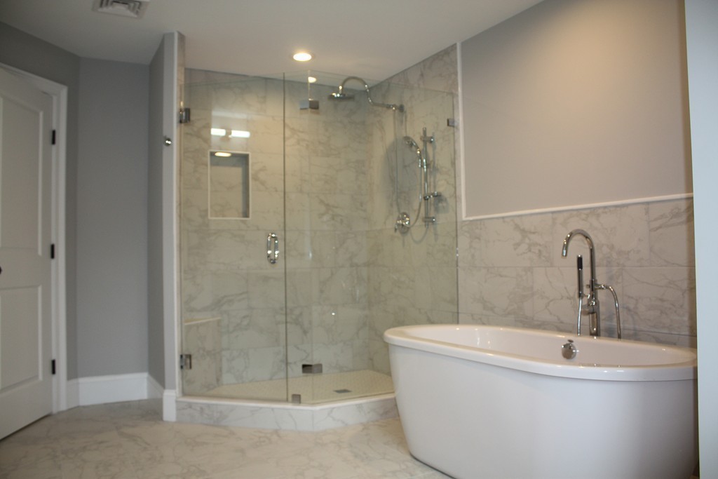 67 Evelyn Road Needham, MA 02494 - Photo 11 of 13 a bathroom with a bathtub and shower
