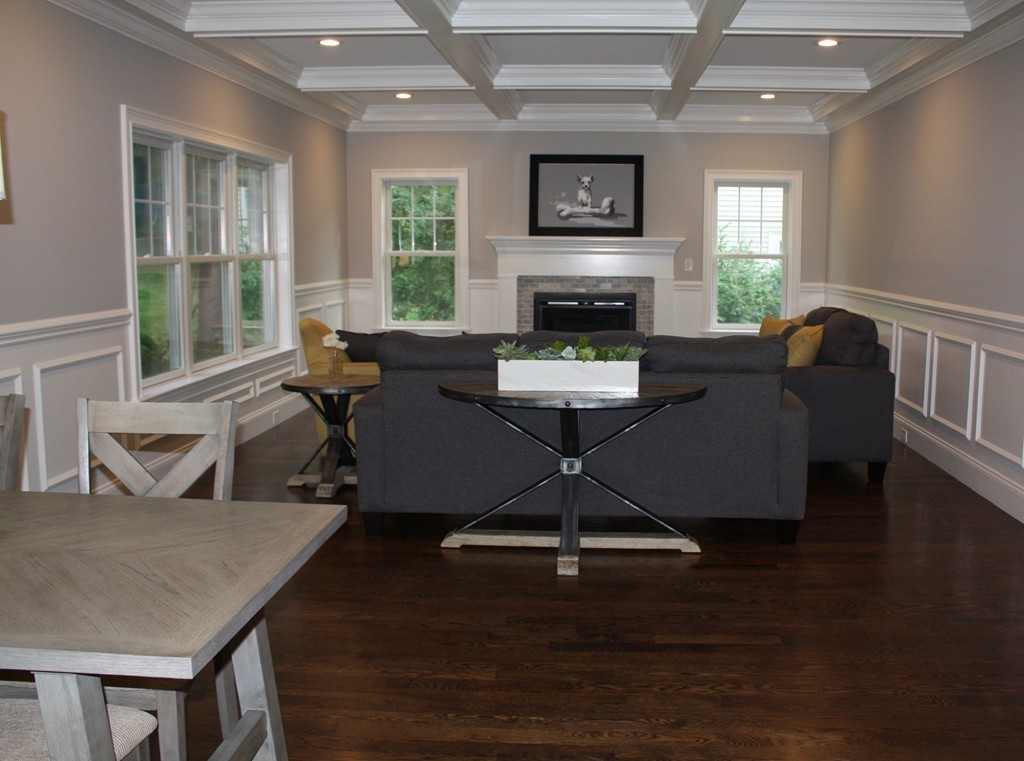 67 Evelyn Road Needham, MA 02494 - Photo 6 of 13 a living room with furniture a flat screen tv and a large window