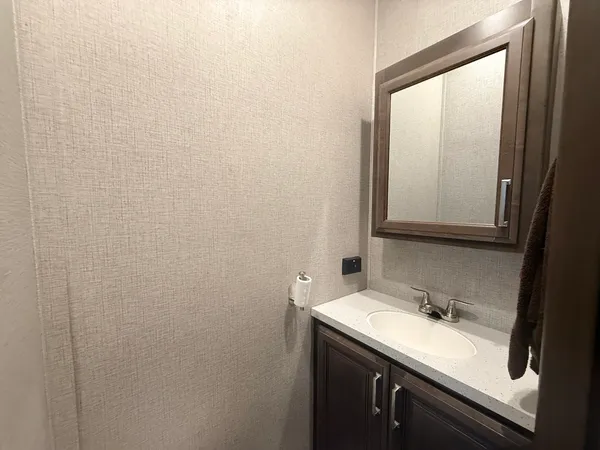 a bathroom with a sink and a mirror