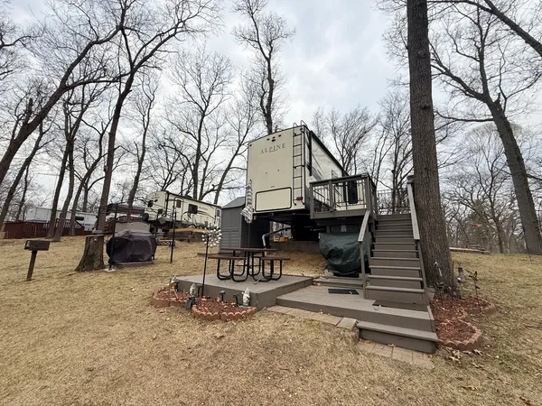 a view of a backyard with sitting area