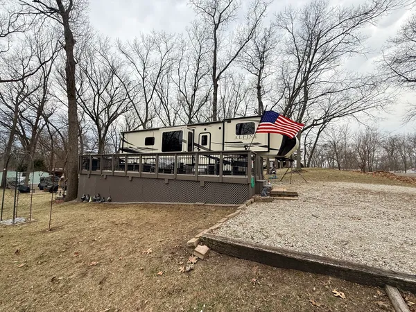 a swimming pool with outdoor seating and yard