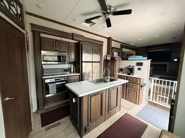 a kitchen that has a stove and a refrigerator