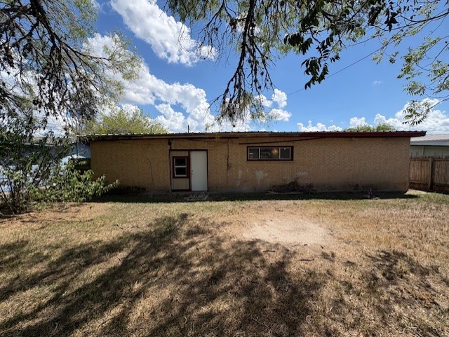 503 Marie Place Beeville, TX 78102 - Photo 7 of 30 a front view of a house with a yard and garage