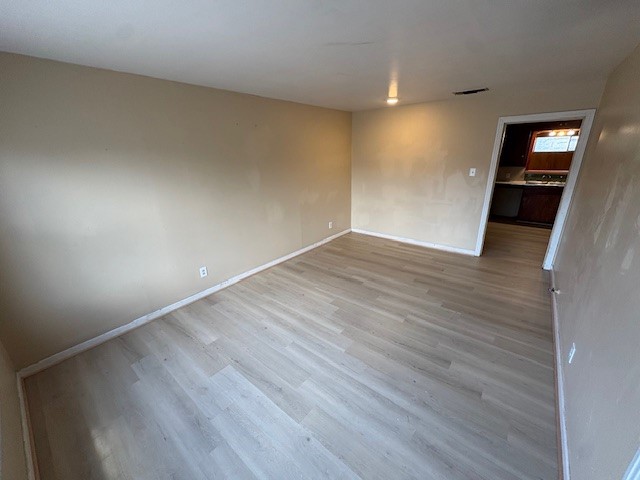503 Marie Place Beeville, TX 78102 - Photo 9 of 30 a view of empty room with wooden floor