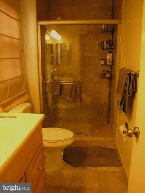 10277 Gainsborough Road Potomac, MD 20854 - Photo 11 of 14 a bathroom with a sink and a shower
