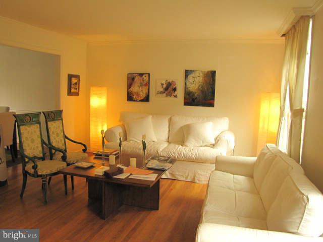 10277 Gainsborough Road Potomac, MD 20854 - Photo 4 of 14 a living room with furniture and wooden floor