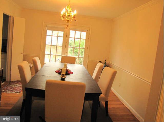 10277 Gainsborough Road Potomac, MD 20854 - Photo 6 of 14 a dining room with furniture and window