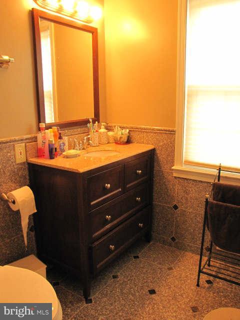 10277 Gainsborough Road Potomac, MD 20854 - Photo 10 of 14 a bathroom with a sink and a mirror