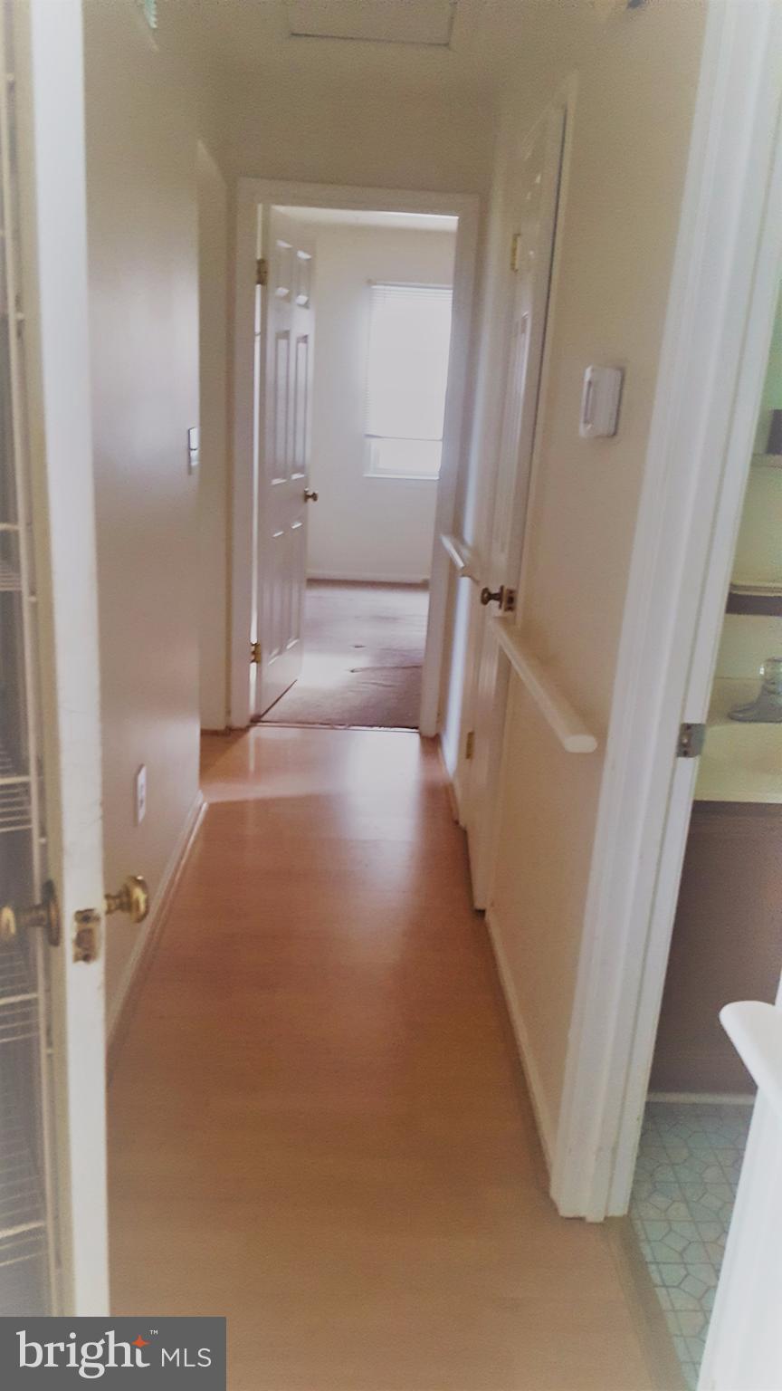 1642 Marlboro Road Edgewater, MD 21037 - Photo 7 of 27 a view of a hallway with wooden floor and staircase