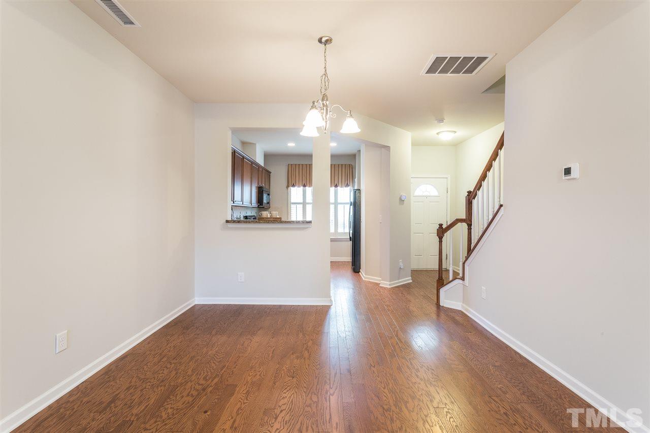 3106 Berkeley Springs Place Raleigh, NC 27616 - Photo 14 of 26 a view of a room with wooden floor and white walls