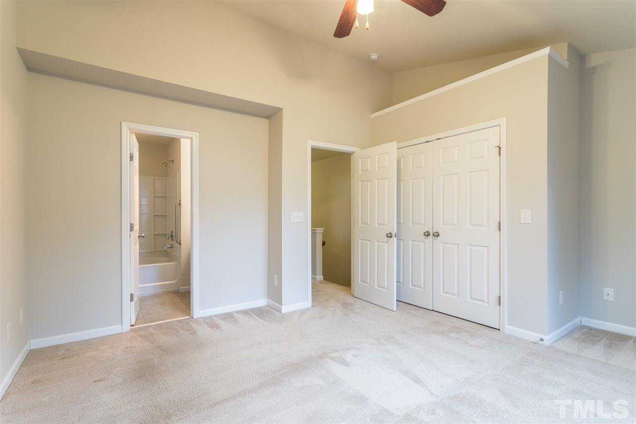 3106 Berkeley Springs Place Raleigh, NC 27616 - Photo 18 of 26 an empty room with a empty space and windows