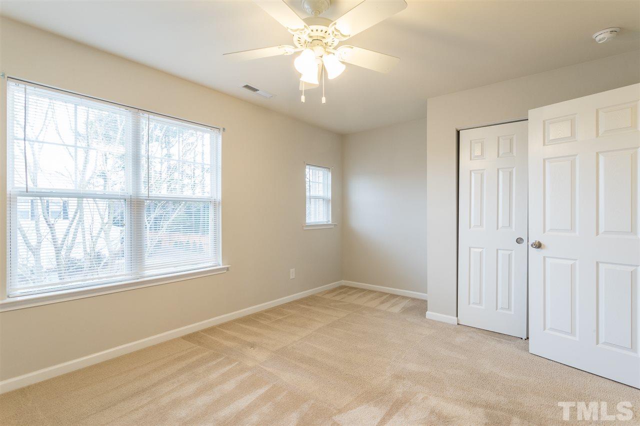 3106 Berkeley Springs Place Raleigh, NC 27616 - Photo 20 of 26 a view of an empty room with a window