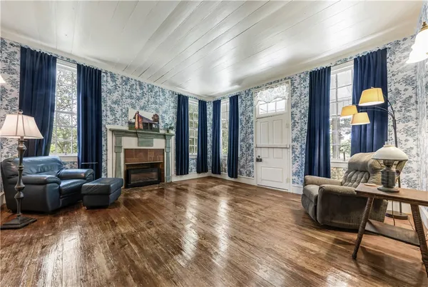 a living room with furniture and a fireplace