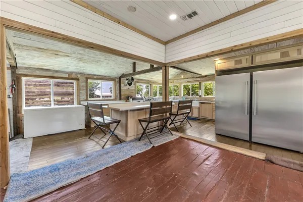 a view of a dining room with furniture window and wooden floor