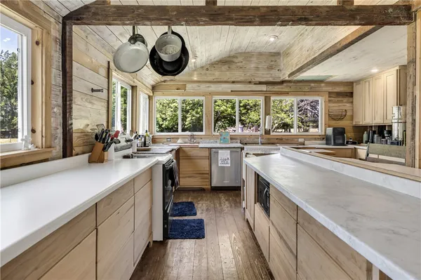 a kitchen with a sink and a stove top oven