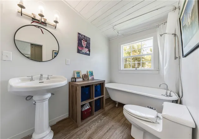 a spacious bedroom with a bed and a fireplace