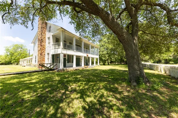 a house with a tree in the background