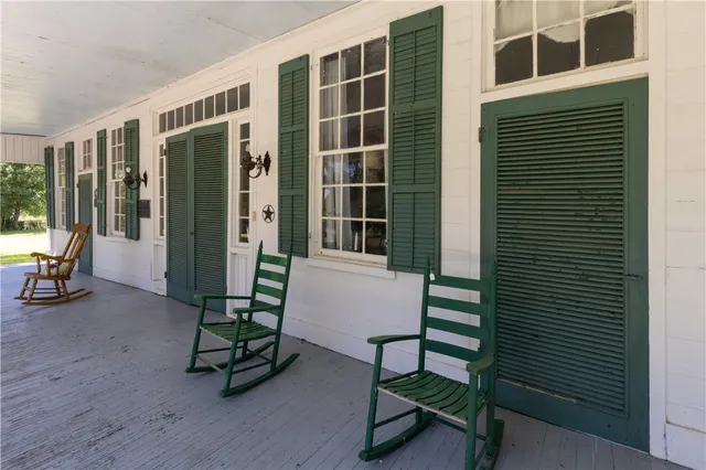 a view of living room kitchen and entryway