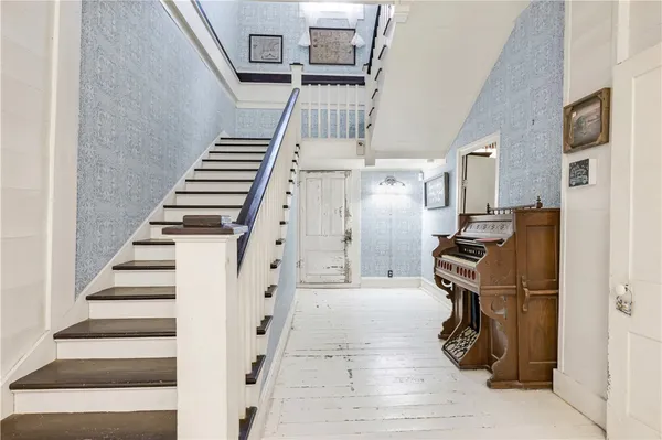 a view of entryway with wooden floor