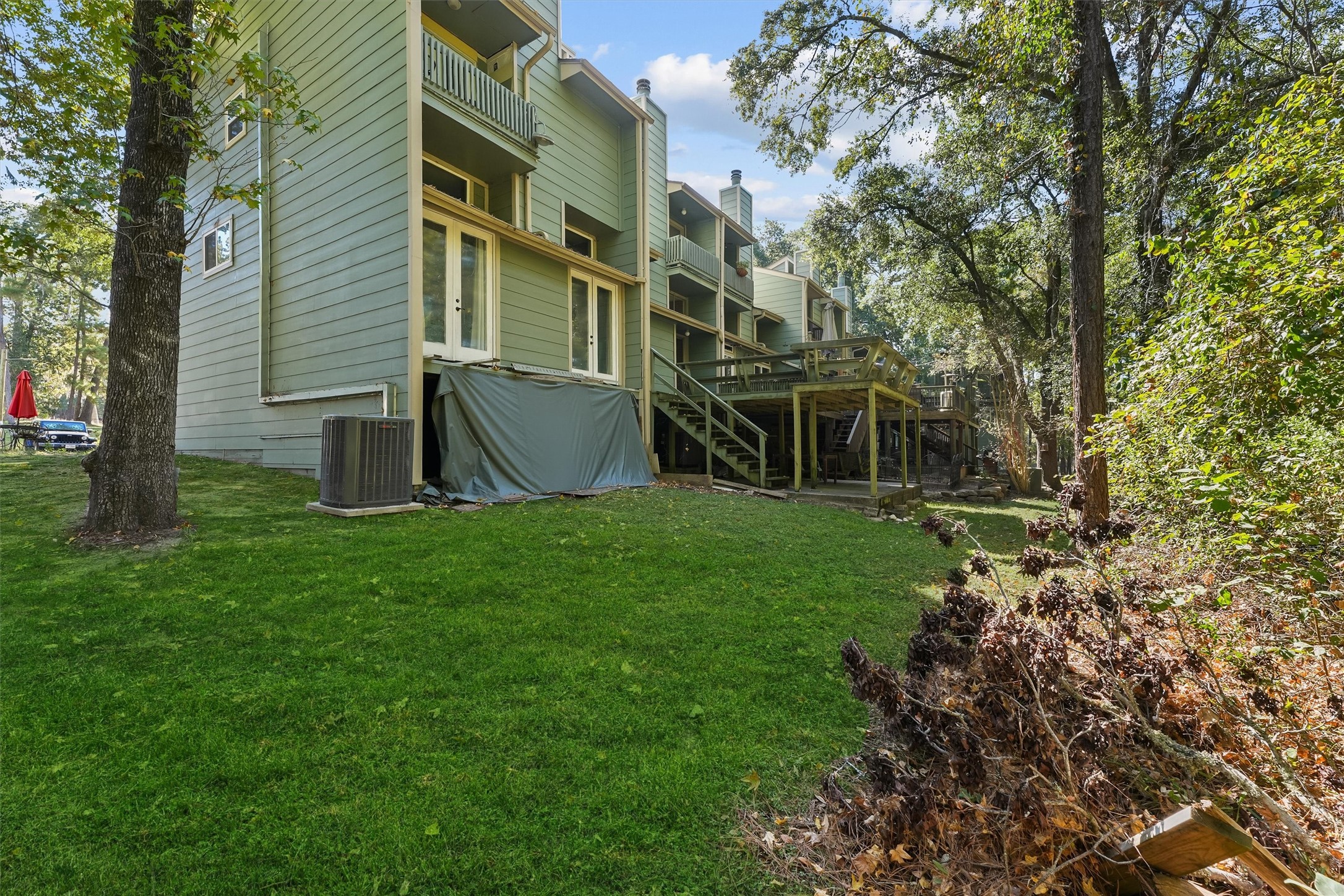 102 Villa Way Coldspring, TX 77331 - Photo 13 of 34 a view of house with backyard