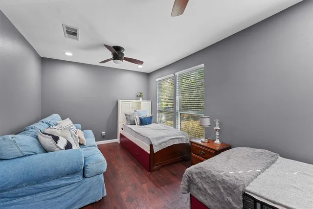 a bedroom with bed and window