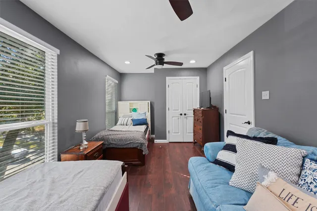 a bedroom with furniture and a window