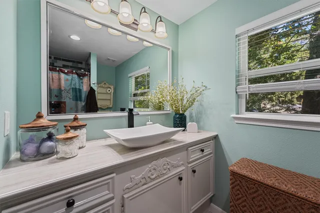 a room with sink and view of living room