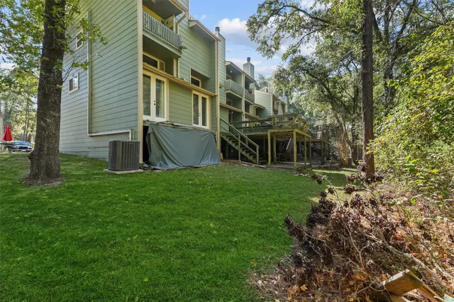 a view of house with backyard