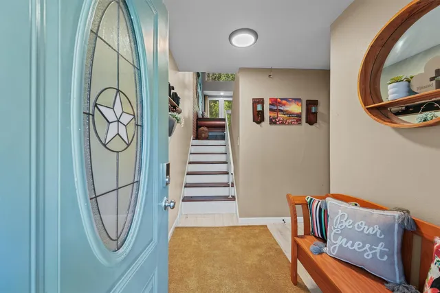 a bathroom with a window and a shower