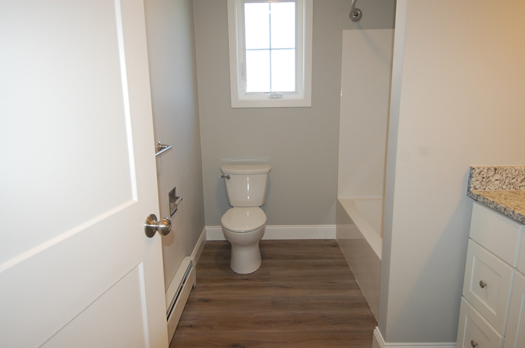 9 Bolton Road, Unit S Dartmouth, MA 02748 - Photo 17 of 19 a bathroom with a toilet and a window
