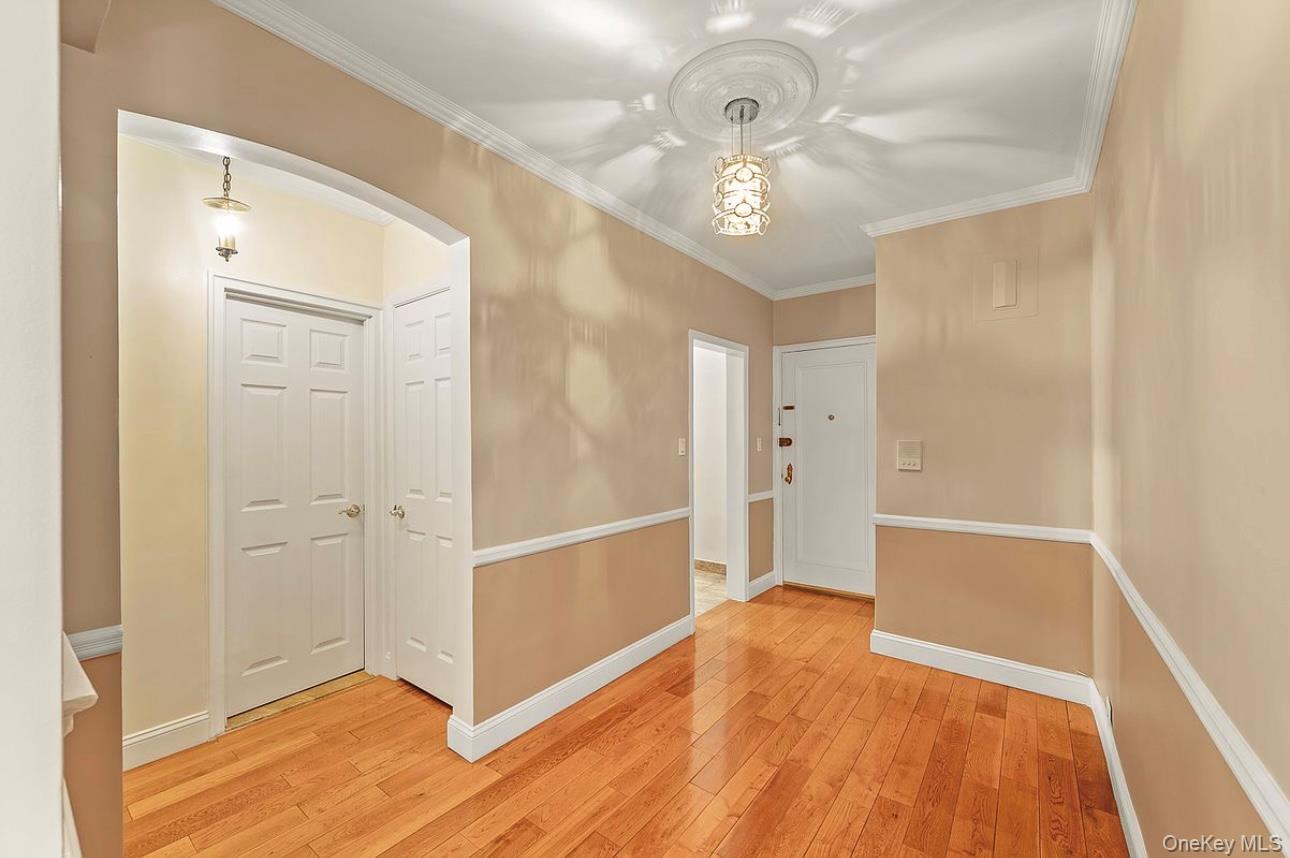 22-28 77th Street, Unit C1 Queens, NY 11370 - Photo 3 of 7 a view of entryway with front door