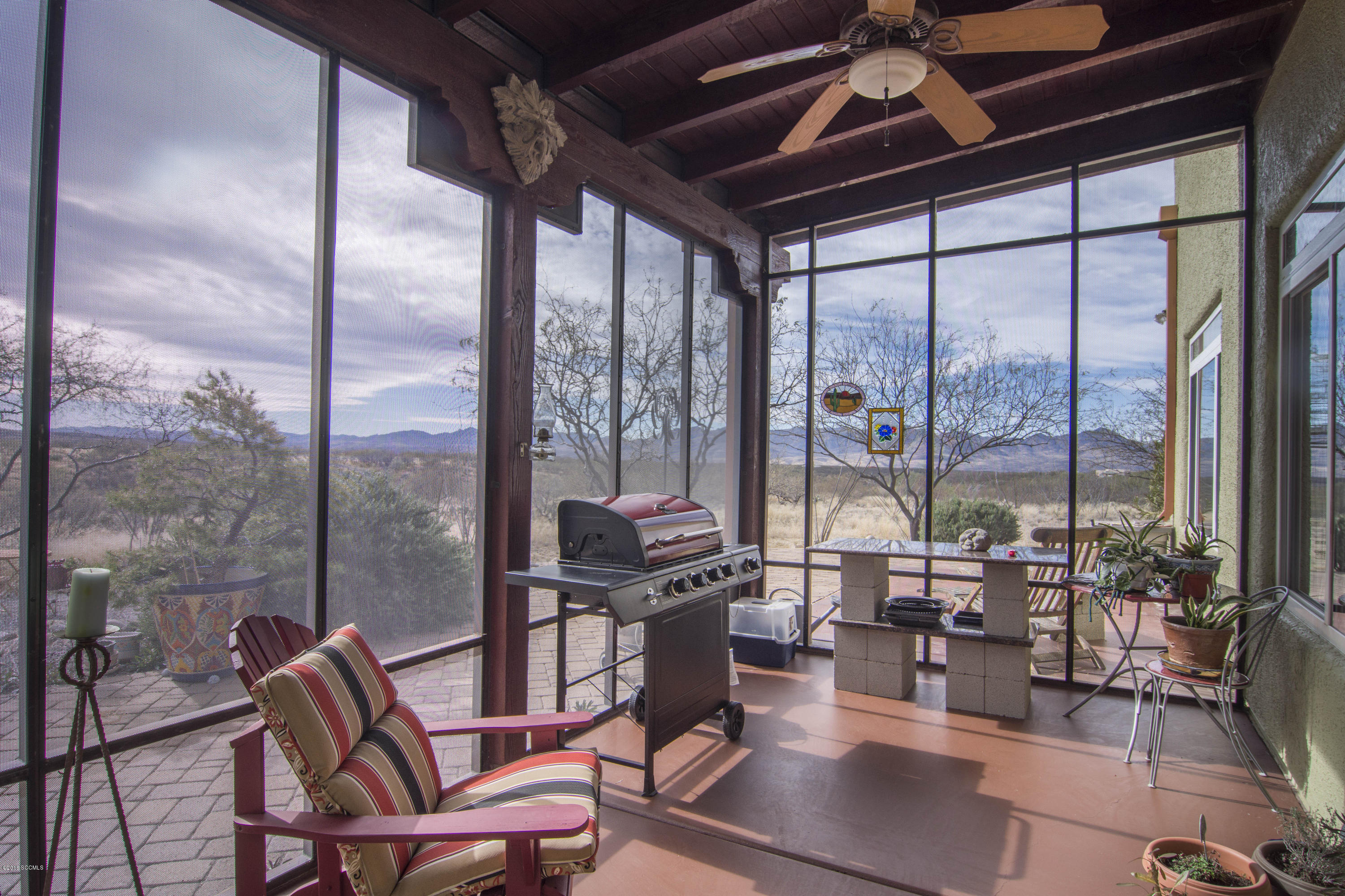 66 Camino Nacozari Rio Rico, AZ 85648 - Photo 49 of 55 a living room with furniture and a floor to ceiling window