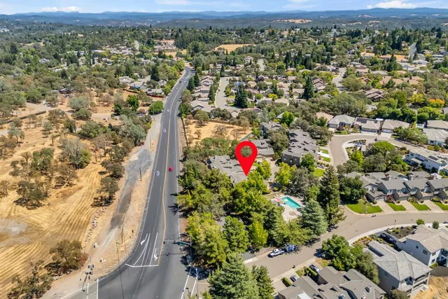 an aerial view of residential house with outdoor space