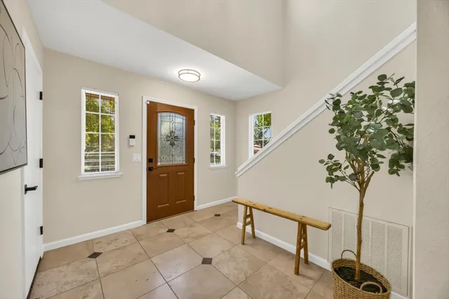 a view of an entryway with wooden floor
