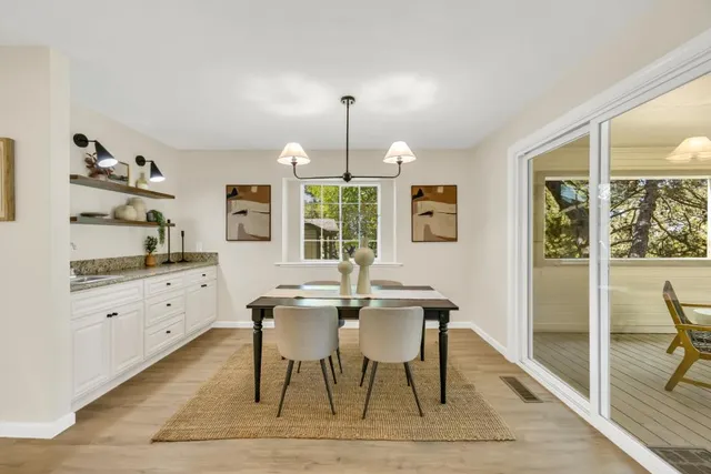a view of a dining room with furniture window and outside view