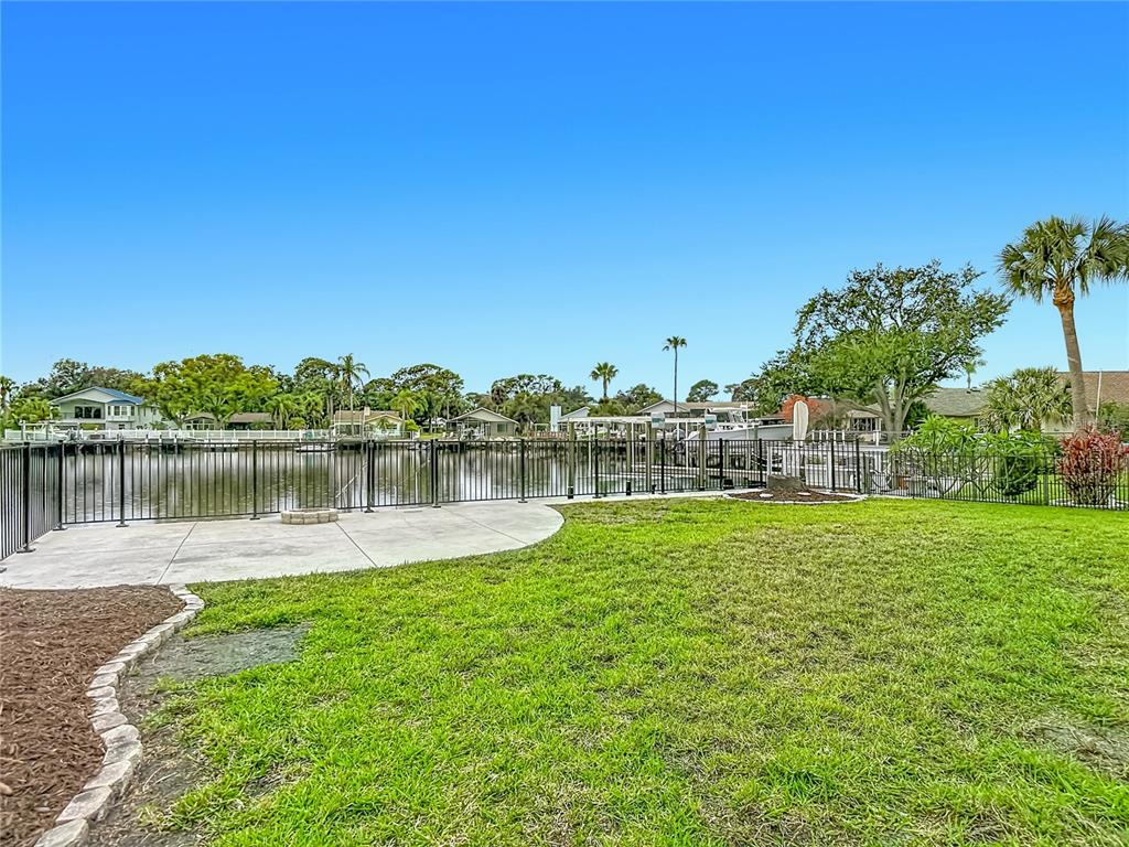 4536 Mitcher Road New Port Richey, FL 34652 - Photo 44 of 46 a view of a lake with houses in the back