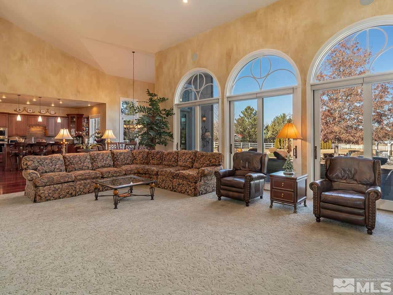 1345 View Crest Court Reno, NV 89511 - Photo 12 of 40 a living room with furniture and a large window
