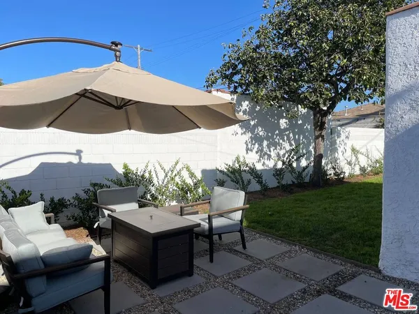 a view of a patio in backyard