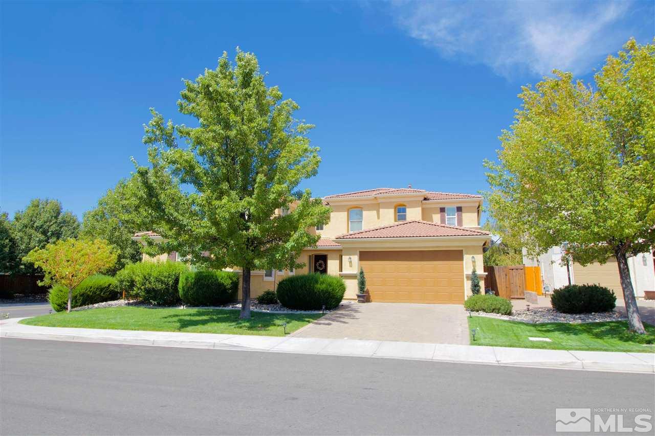 505 Terracina Way Reno, NV 89521 - Photo 1 of 26 a front view of a house with a yard and garage