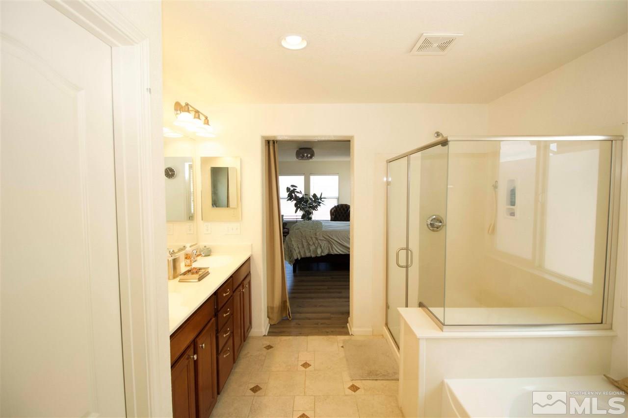 505 Terracina Way Reno, NV 89521 - Photo 16 of 26 a en suite bathroom with a sink a toilet and shower