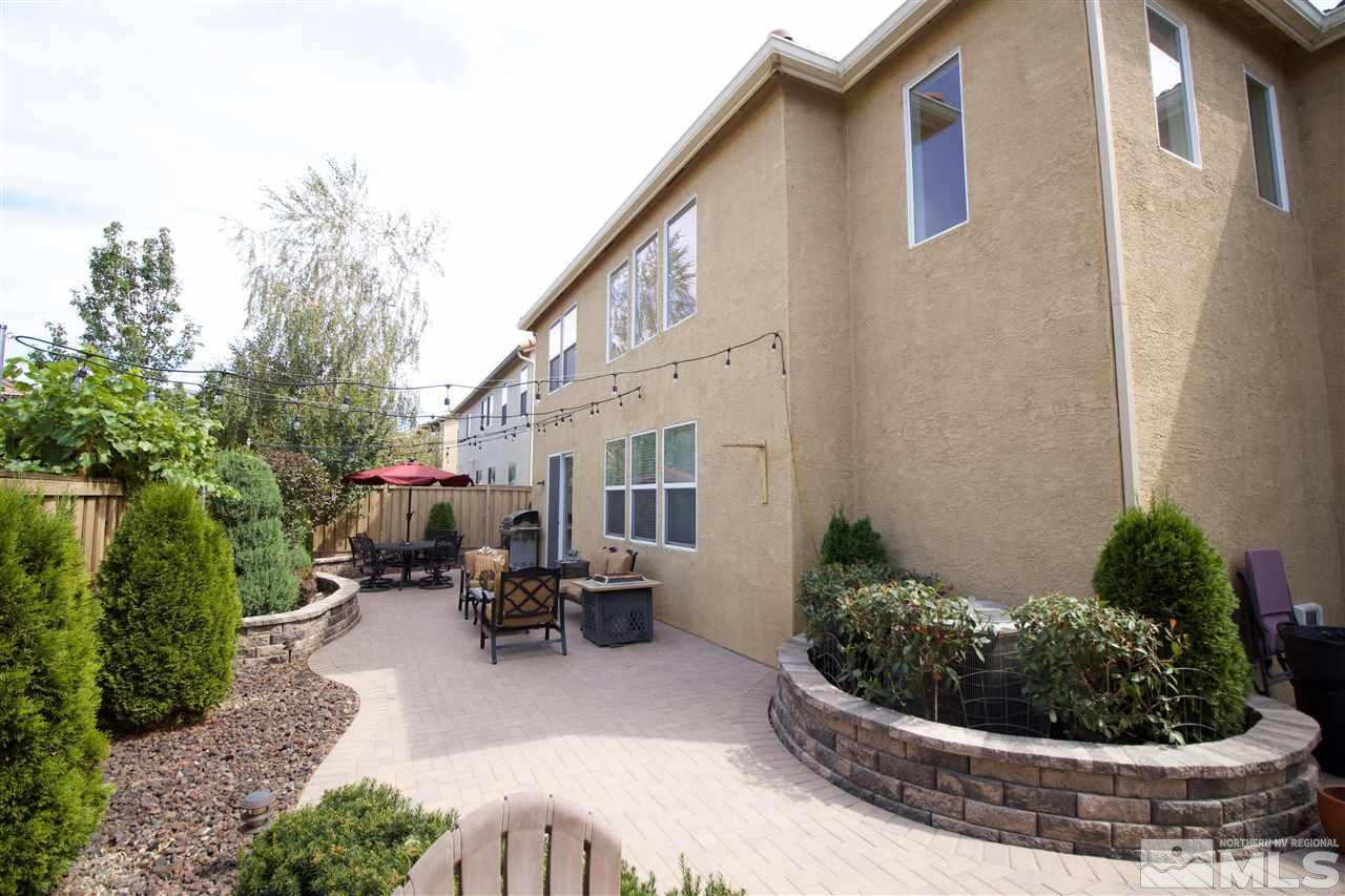 505 Terracina Way Reno, NV 89521 - Photo 23 of 26 a view of a patio with chair and tables back yard of the house
