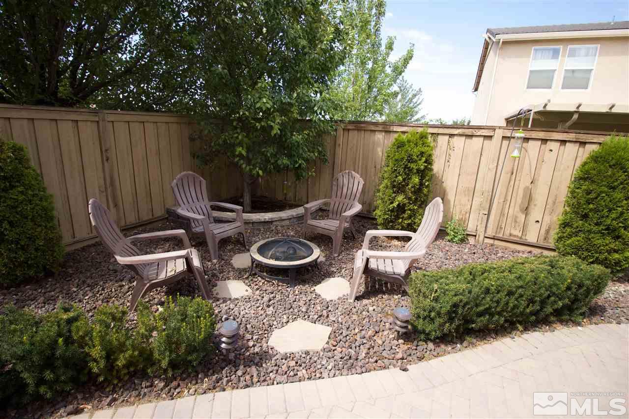 505 Terracina Way Reno, NV 89521 - Photo 24 of 26 a view of a backyard with chair and a grill