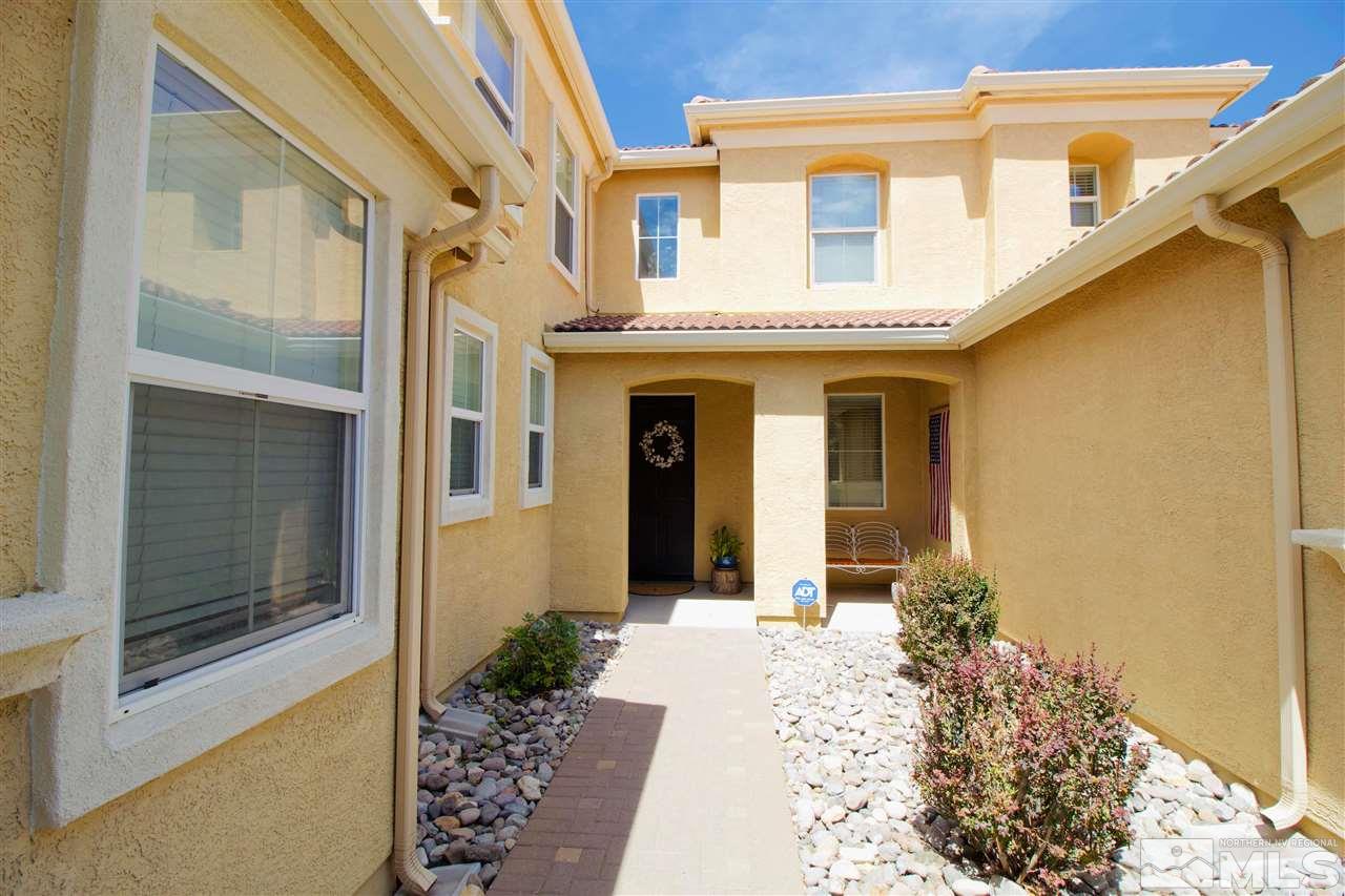 505 Terracina Way Reno, NV 89521 - Photo 3 of 26 a front view of a house with a glass door